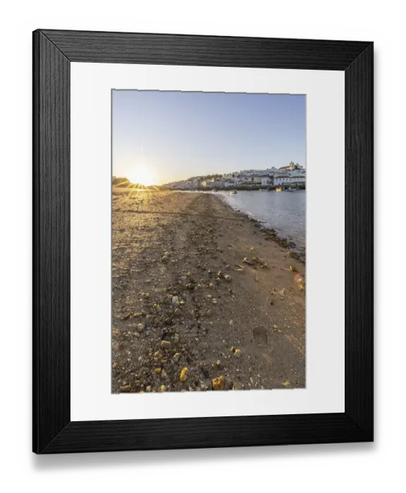 Framed Print : Sunrise on the Atlantic, skyline of a fishing village behind a harbour Framed Print : Sunrise on the Atlantic, skyline of a fishing village behind a harbour