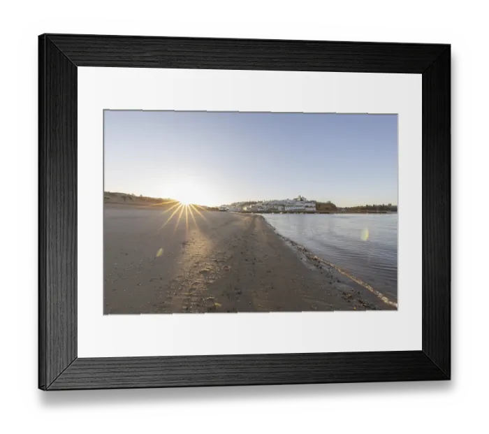 Framed Print : Sunrise on the Atlantic, skyline of a fishing village behind a harbour Framed Print : Sunrise on the Atlantic, skyline of a fishing village behind a harbour