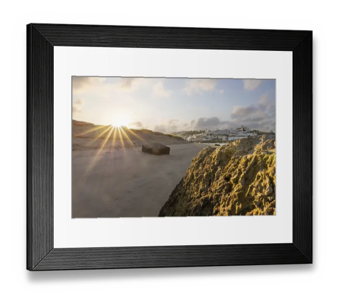 Framed Print : Sunrise on the Atlantic, skyline of a fishing village behind a harbour Framed Print : Sunrise on the Atlantic, skyline of a fishing village behind a harbour
