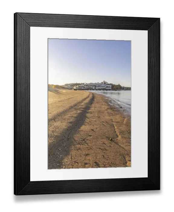 Framed Print : Sunrise on the Atlantic, skyline of a fishing village behind a harbour Framed Print : Sunrise on the Atlantic, skyline of a fishing village behind a harbour