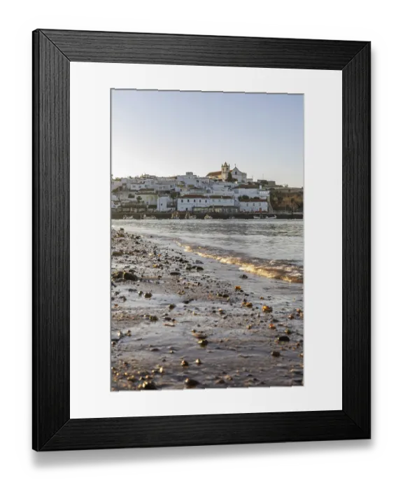 Framed Print : Sunrise on the Atlantic, skyline of a fishing village behind a harbour Framed Print : Sunrise on the Atlantic, skyline of a fishing village behind a harbour