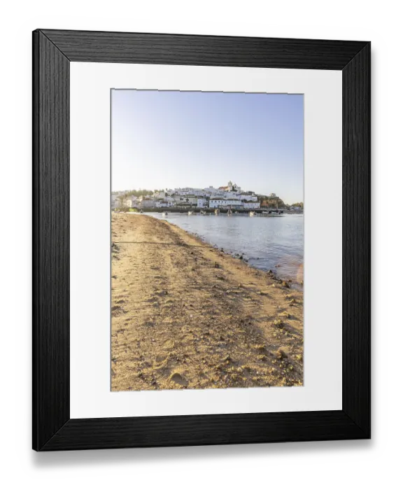 Framed Print : Sunrise on the Atlantic, skyline of a fishing village behind a harbour Framed Print : Sunrise on the Atlantic, skyline of a fishing village behind a harbour