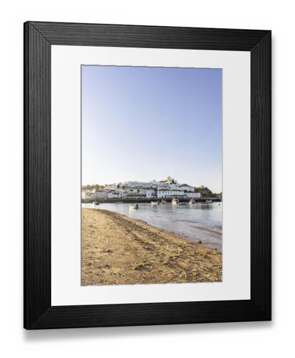 Framed Print : Sunrise on the Atlantic, skyline of a fishing village behind a harbour Framed Print : Sunrise on the Atlantic, skyline of a fishing village behind a harbour