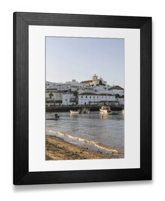 Framed Print : Sunrise on the Atlantic, skyline of a fishing village behind a harbour Framed Print : Sunrise on the Atlantic, skyline of a fishing village behind a harbour
