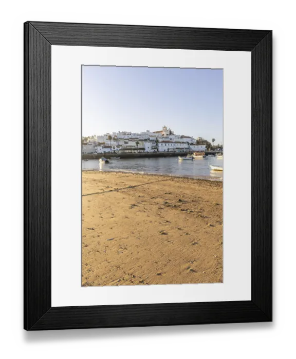 Framed Print : Sunrise on the Atlantic, skyline of a fishing village behind a harbour Framed Print : Sunrise on the Atlantic, skyline of a fishing village behind a harbour