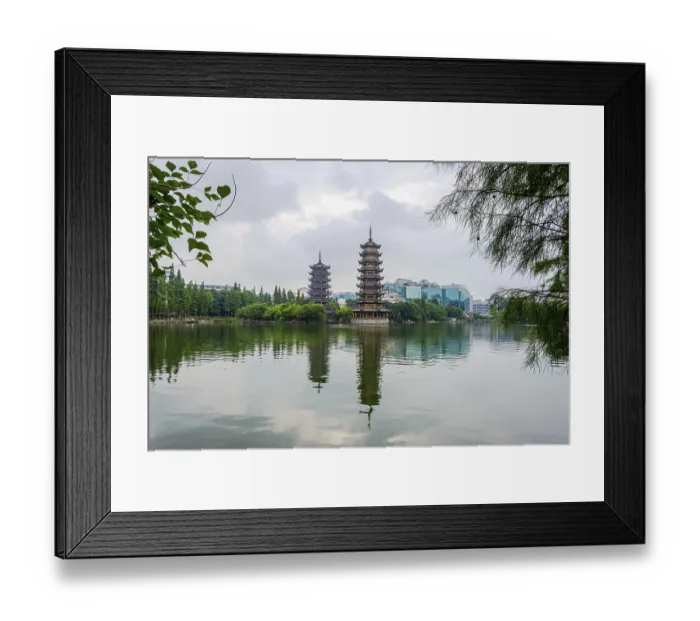 Framed Print : Two towers, pagodas of Sun and Moon by the lake