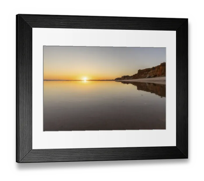 Framed Print : Sea with reflection at low tide in the calm waters of the Atlantic