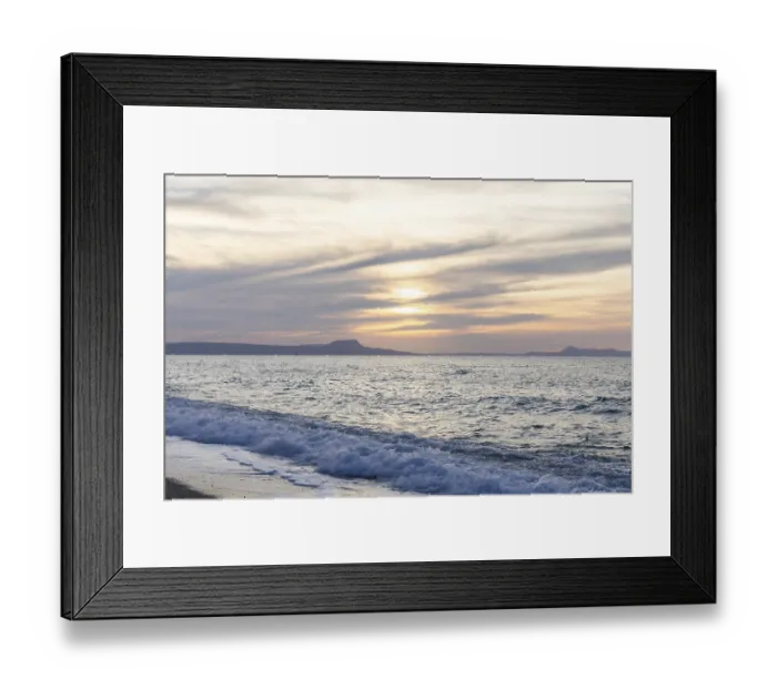 Framed Print : Beautiful coastline with a sandy beach and pebble beach at sunset