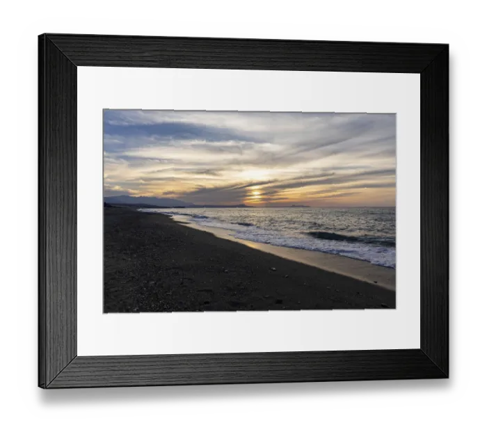 Framed Print : Beautiful coastline with a sandy beach and pebble beach at sunset Framed Print : Beautiful coastline with a sandy beach and pebble beach at sunset