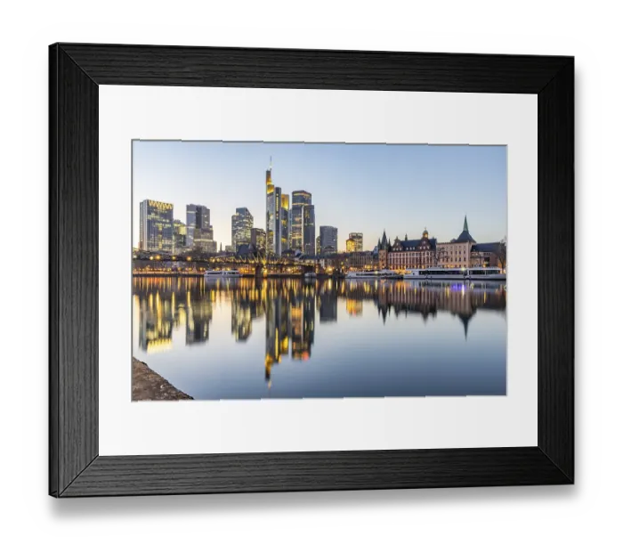 Framed Print : View over the river Main with a modern illuminated skyline in the background in the evening