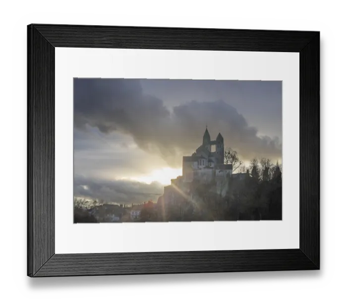 Framed Print : A winter landscape at sunrise. Lots of nature and a large church on a rock