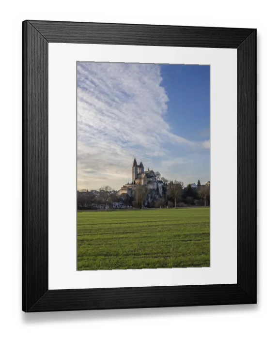 Framed Print : A winter landscape at sunrise. Lots of nature and a large church on a rock