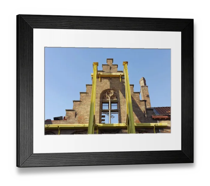 Framed Print : Steel girders support staircase gable of a historic house facade Framed Print : Steel girders support staircase gable of a historic house facade