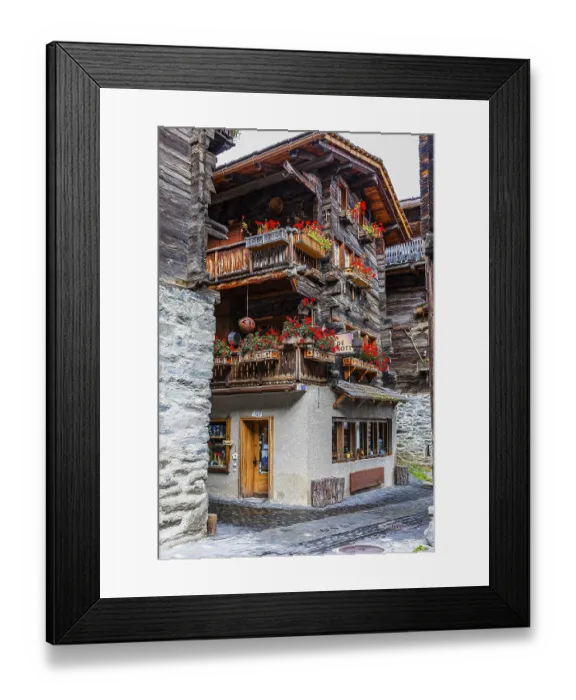 Framed Print : Old house decorated with flowers in the historic village centre
