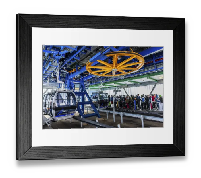 Framed Print : Skiers queue at the valley station for the ascent with the cable car to the Bendolla ski area Framed Print : Skiers queue at the valley station for the ascent with the cable car to the Bendolla ski area