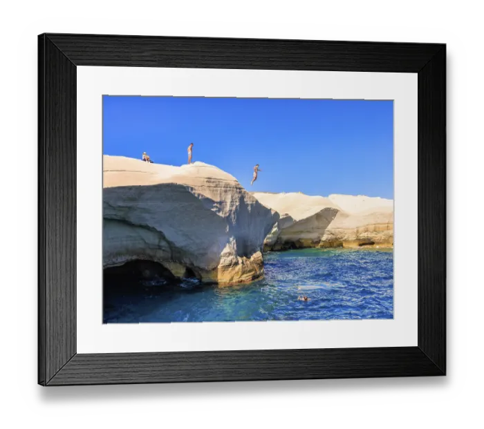 Framed Print : Man jumping from the cliff into the sea at Sarakiniko beach Framed Print : Man jumping from the cliff into the sea at Sarakiniko beach