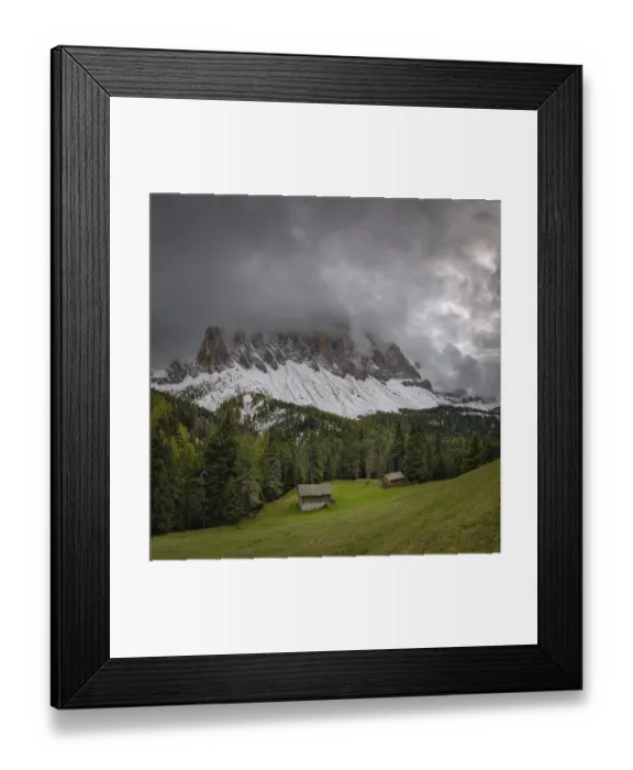 Framed Print : View of a part of the Geisler group in the foreground two mountain huts Framed Print : View of a part of the Geisler group in the foreground two mountain huts