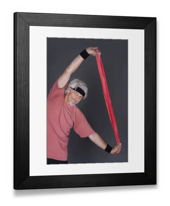 Framed Print : Elderly man with fitness outfit trains with fitness band