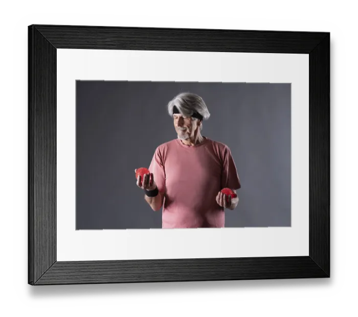 Framed Print : Elderly man with fitness outfit trains with fitness ball Framed Print : Elderly man with fitness outfit trains with fitness ball
