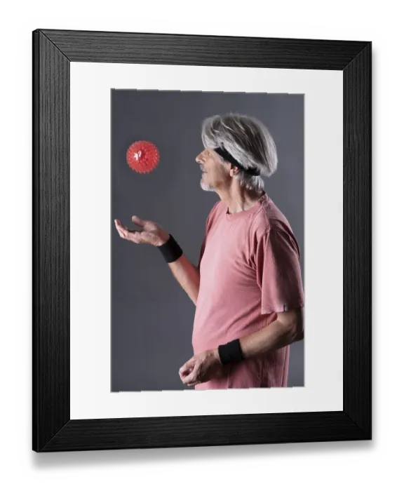 Framed Print : Elderly man with fitness outfit trains with fitness ball Framed Print : Elderly man with fitness outfit trains with fitness ball
