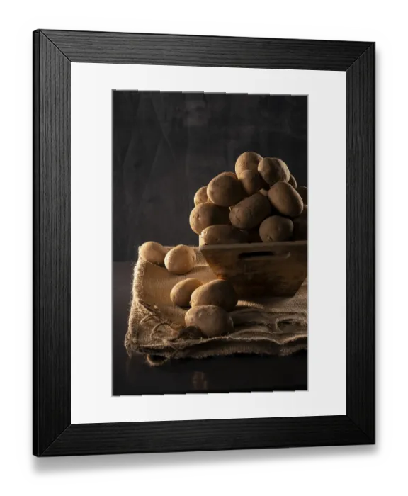 Framed Print : Potatoes in a wooden bowl, still life