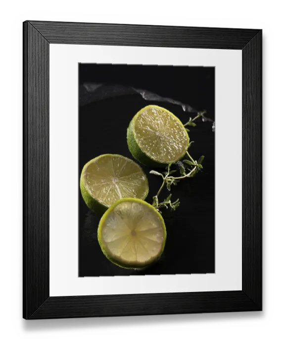 Framed Print : Three lime slices on a black stone plate Framed Print : Three lime slices on a black stone plate