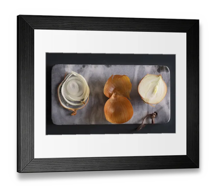 Framed Print : Onion slices on a stone slab