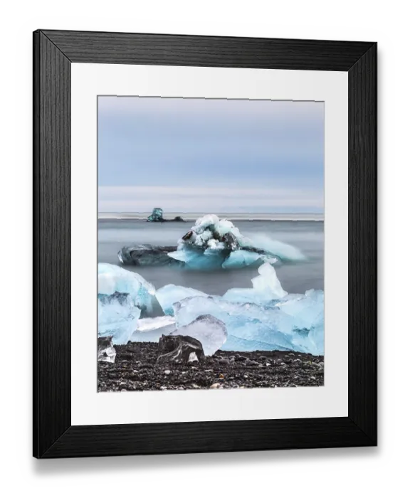 Framed Print : Blue icebergs and chunks floating in a calm ocean scene