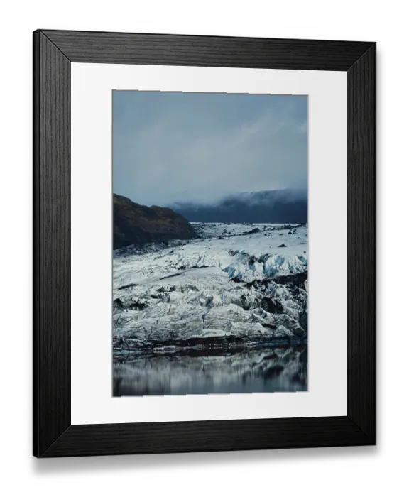 Framed Print : Vast glacier with rugged ice formations beneath a cloudy sky