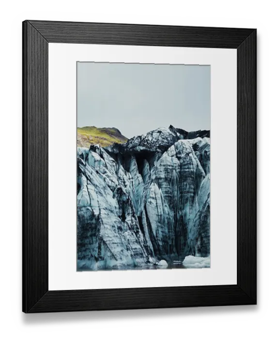 Framed Print : Towering blue glacier peaks with a hint of green vegetation above