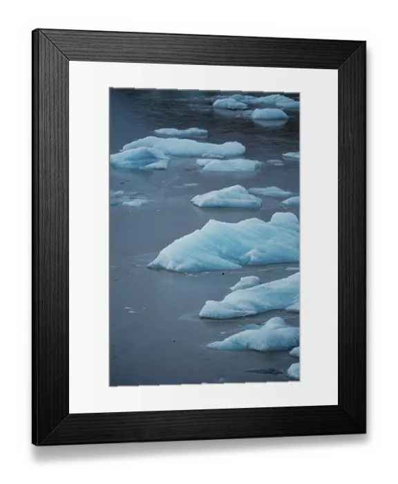 Framed Print : Ice pieces floating in still water with a blue tint Framed Print : Ice pieces floating in still water with a blue tint