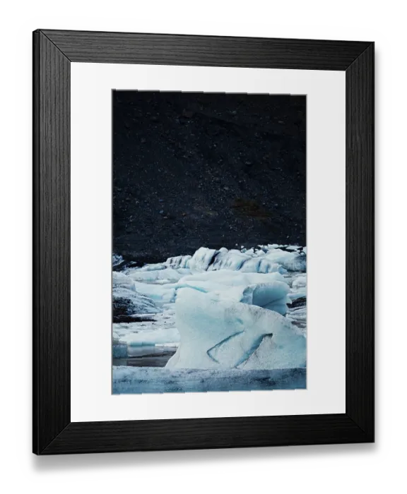 Framed Print : Textured ice formations stand out against a dark
