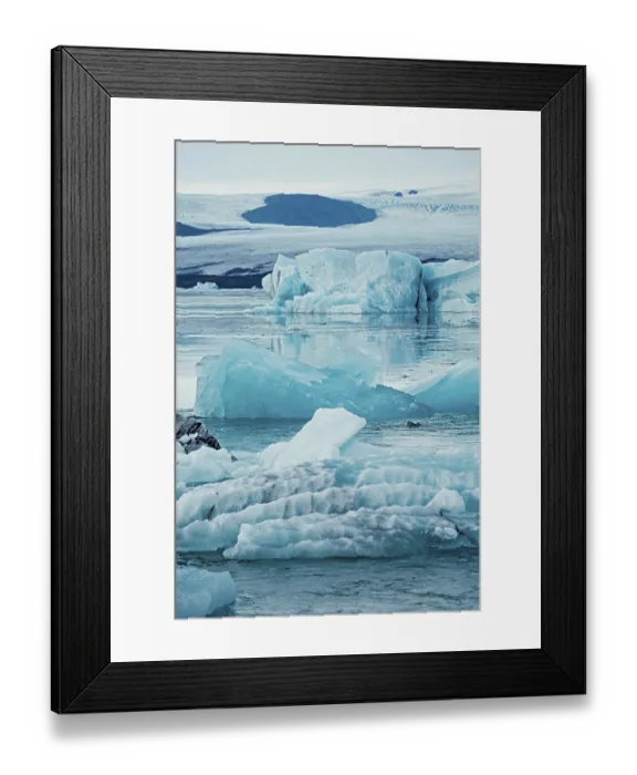 Framed Print : Floating icebergs in a tranquil and cold environment Framed Print : Floating icebergs in a tranquil and cold environment