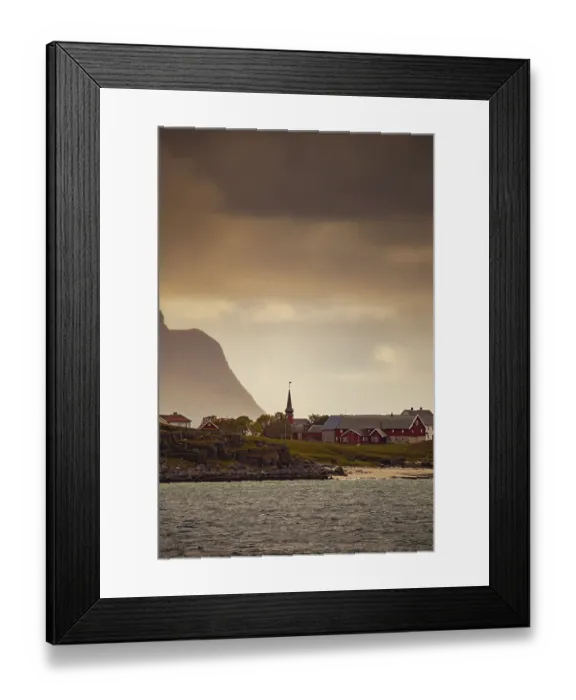 Framed Print : A coastal village with a church