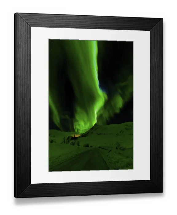 Framed Print : Waves of green aurora borealis light up the night sky above snow-covered hills Framed Print : Waves of green aurora borealis light up the night sky above snow-covered hills