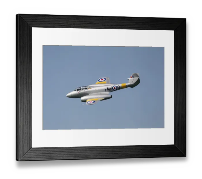 Framed Print : Gloster Meteor jet aircraft in RAF Royal air force colours flying in a blue sky Framed Print : Gloster Meteor jet aircraft in RAF Royal air force colours flying in a blue sky