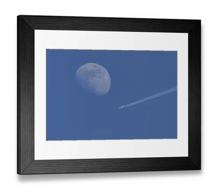 Framed Print : Boeing 737 jet passenger aircraft of Norweign Air with a vapour trial or contrail behind flying in a blue sky passing