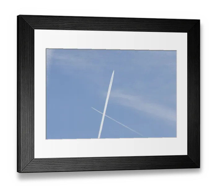 Framed Print : Two jet passenger aircraft with vapour trails or contrails flying in a blue sky crossing making a cross Framed Print : Two jet passenger aircraft with vapour trails or contrails flying in a blue sky crossing making a cross
