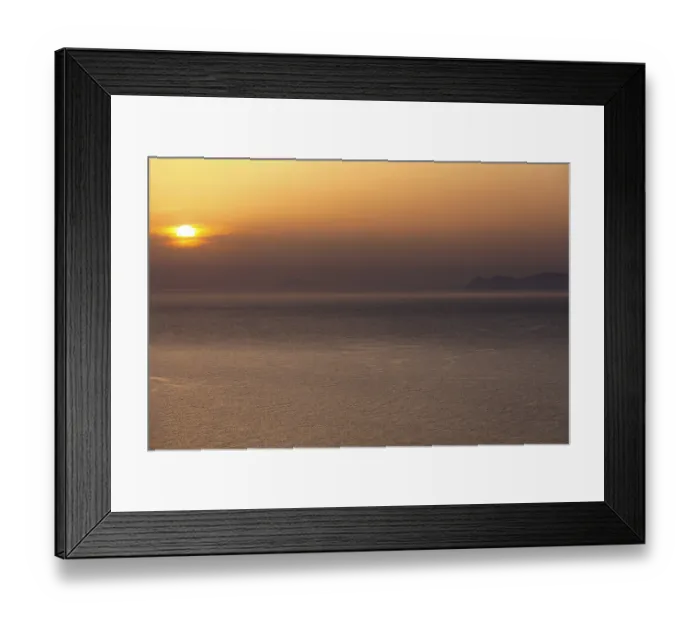 Framed Print : Sunset over the sea near Santorini