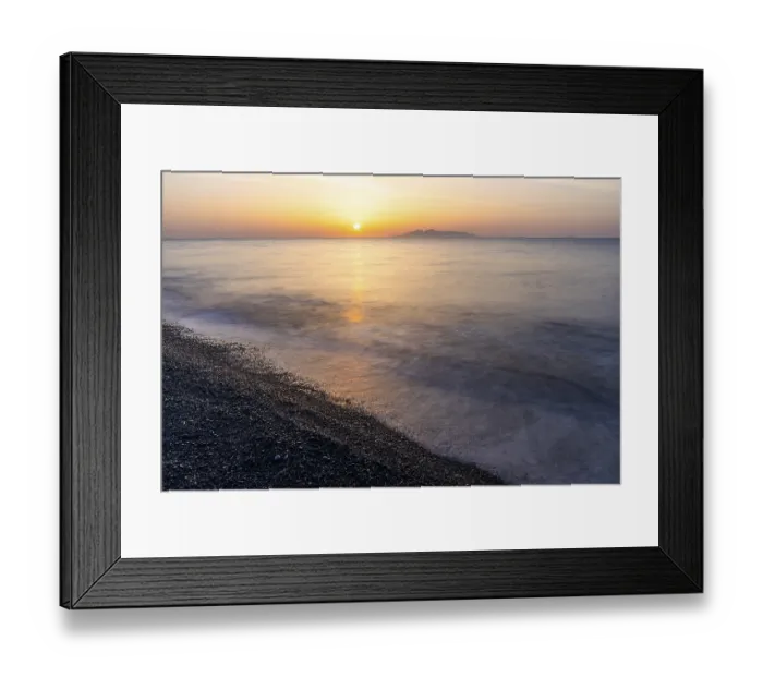 Framed Print : Sunrise, view from the lava beach Kamari to the island Anafi