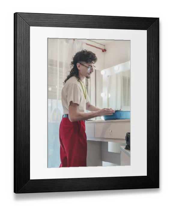 Framed Print : Young artist with a distinctive mullet haircut