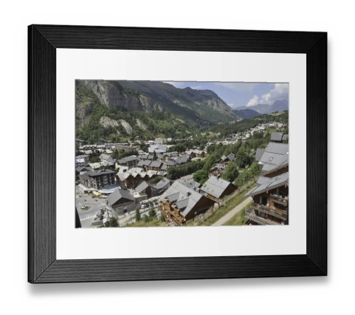 Framed Print : Valoire, A scenic village nestled in a mountainous valley with houses and lush greenery