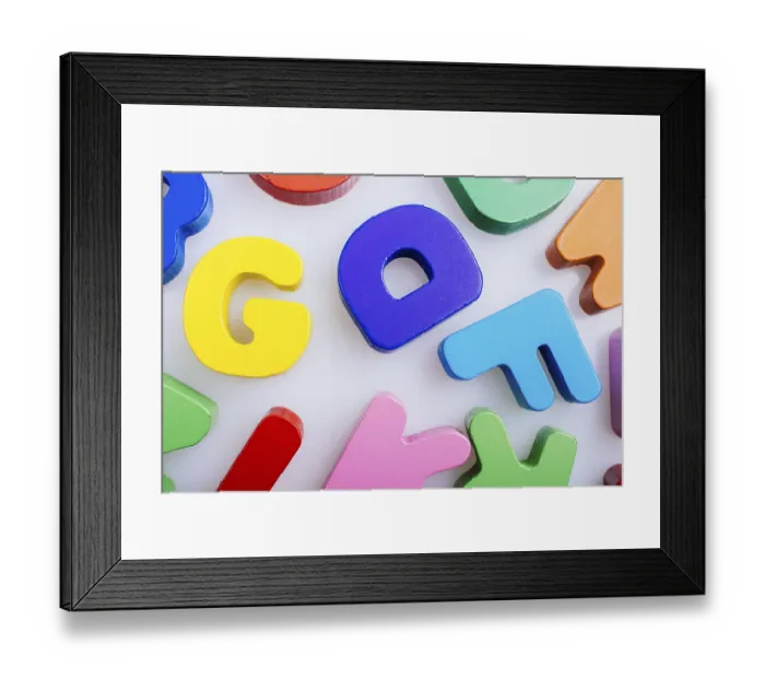 Framed Print : Colorful wooden letters scattered on a white background Framed Print : Colorful wooden letters scattered on a white background