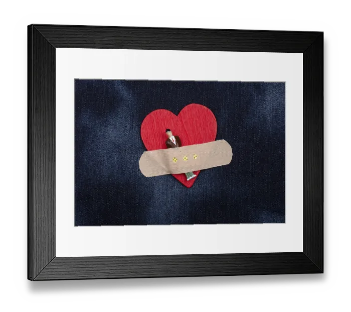 Framed Print : Man figurine on heart icon, Love and Valentines day concept Framed Print : Man figurine on heart icon, Love and Valentines day concept