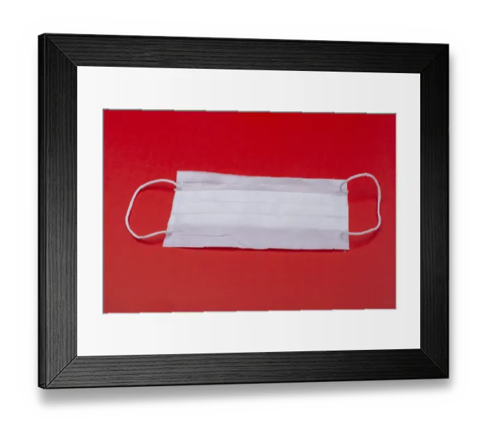 Framed Print : White color medical mask on red color