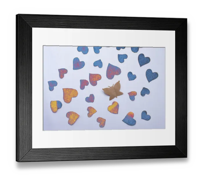 Framed Print : Paper butterfly and paper hearts in red color