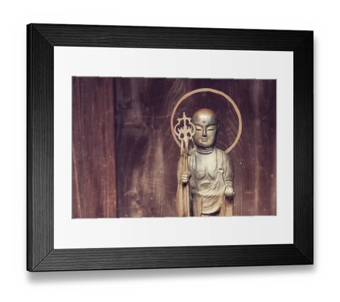 Framed Print : Small Buddha statue near wooden temple wall in Japan Framed Print : Small Buddha statue near wooden temple wall in Japan