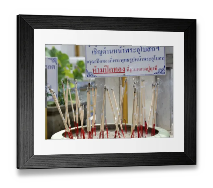 Framed Print : Incense sticks are burning, creating a fragrant smoke Framed Print : Incense sticks are burning, creating a fragrant smoke