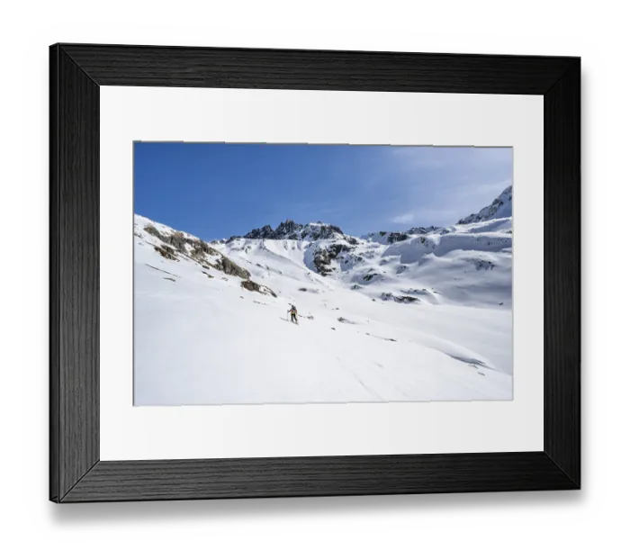 Framed Print : Ski tourer in mountain landscape with snow Framed Print : Ski tourer in mountain landscape with snow