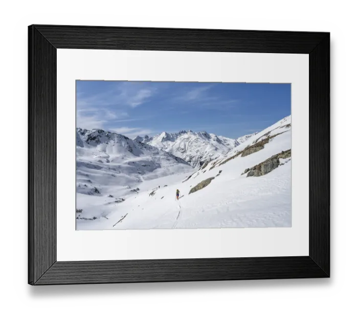 Framed Print : Ski tourer in mountain landscape with snow